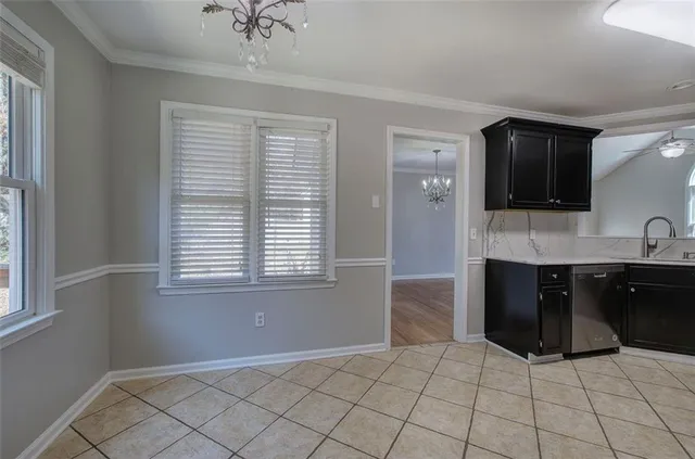a spacious bathroom with a double vanity sink a mirror and a bathtub