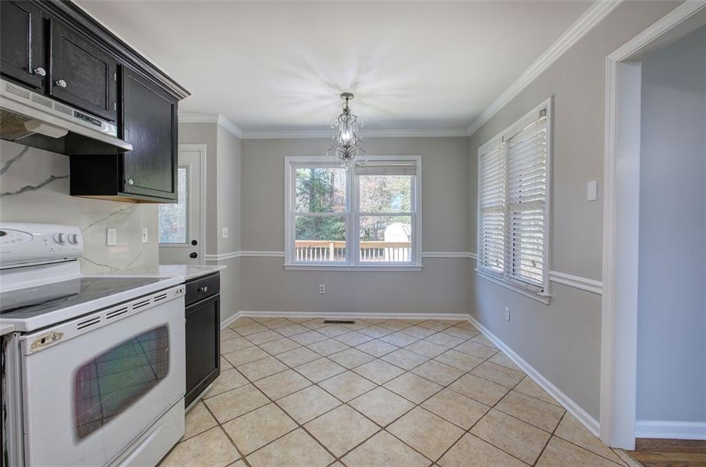 33 Engineer Lane Cartersville, GA 30120 - Photo 19 of 39 a kitchen with granite countertop a stove and a sink