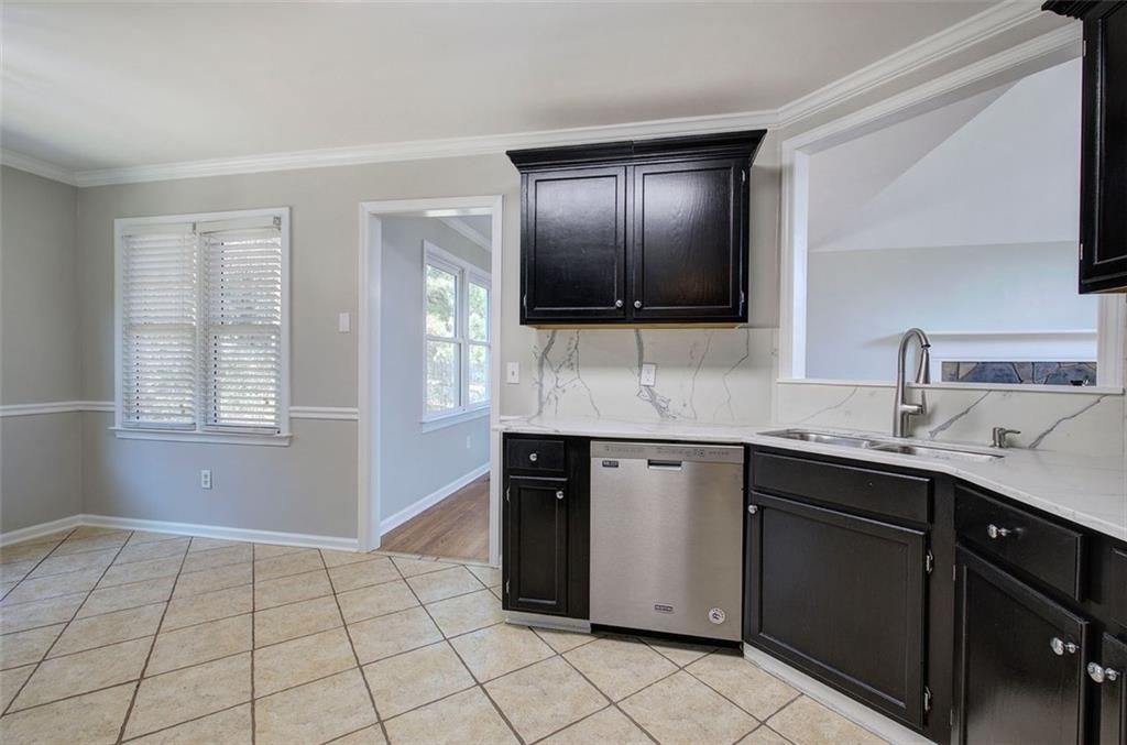 33 Engineer Lane Cartersville, GA 30120 - Photo 20 of 39 a kitchen with a sink and cabinets