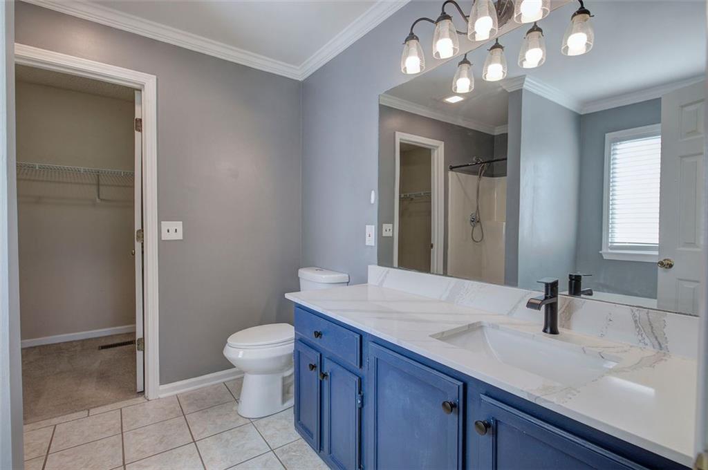 33 Engineer Lane Cartersville, GA 30120 - Photo 24 of 39 a bathroom with a sink a toilet and a mirror