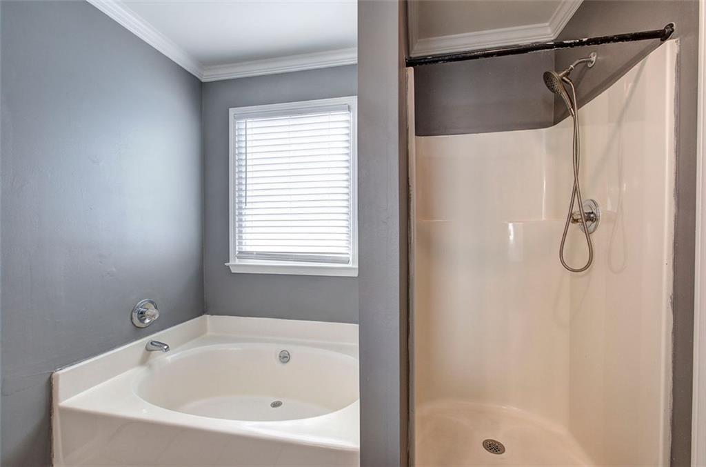 33 Engineer Lane Cartersville, GA 30120 - Photo 25 of 39 a white bath tub with a shower