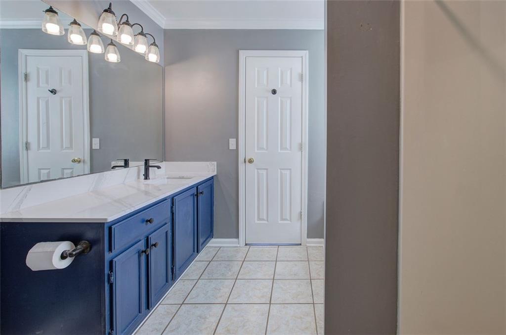 33 Engineer Lane Cartersville, GA 30120 - Photo 27 of 39 a bathroom with a sink and a mirror