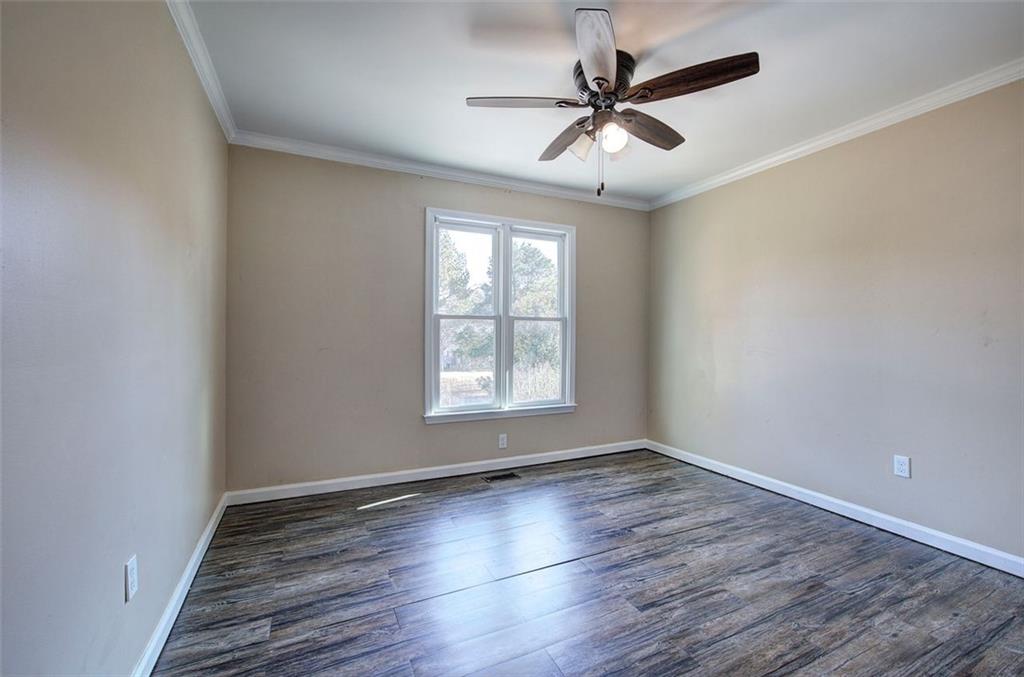 33 Engineer Lane Cartersville, GA 30120 - Photo 31 of 39 wooden floor in an empty room with a window