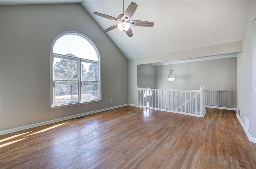 33 Engineer Lane Cartersville, GA 30120 - Photo 10 of 39 a view of an empty room with wooden floor and a window