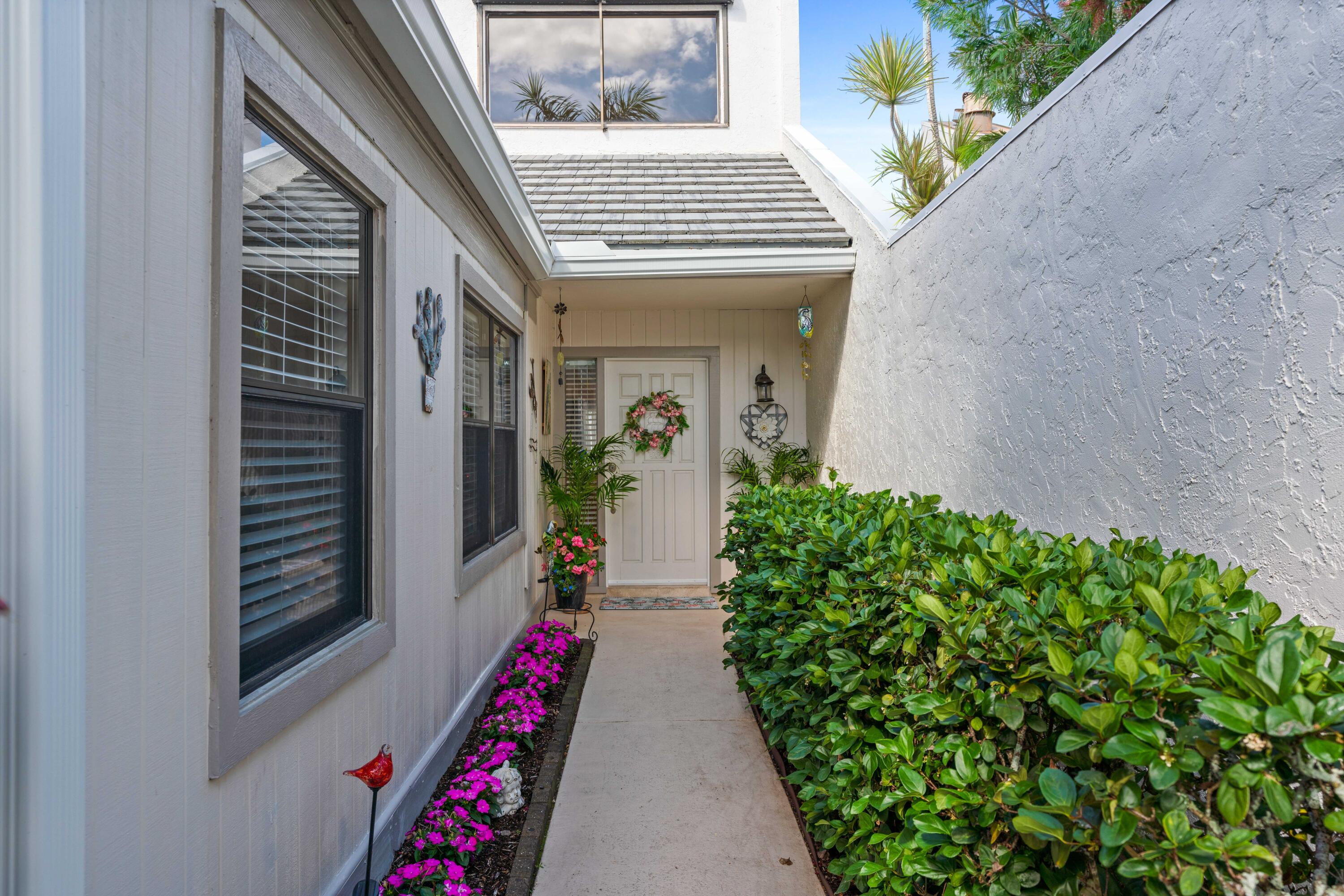 17023 Traverse Circle Jupiter, FL 33477 - Photo 3 of 35 a view of an entryway door and balcony