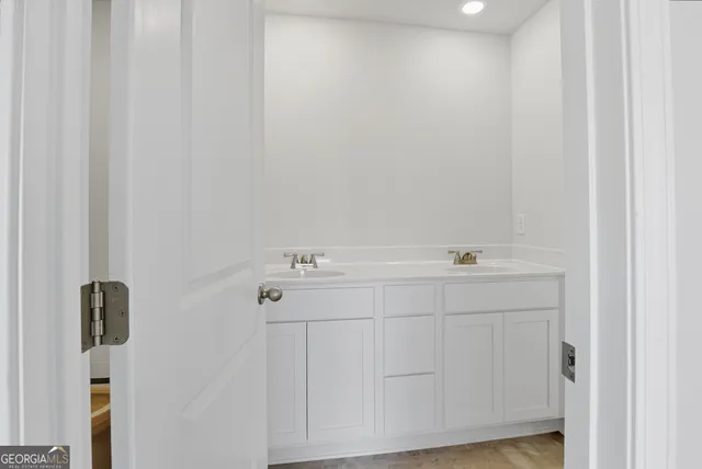 a bathroom with a sink and mirror