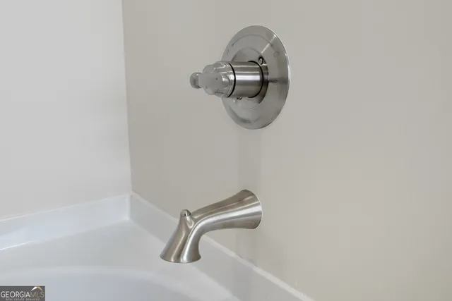 a close view of a bathtub in bathroom