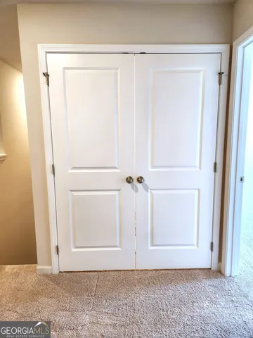 an empty room with wooden door