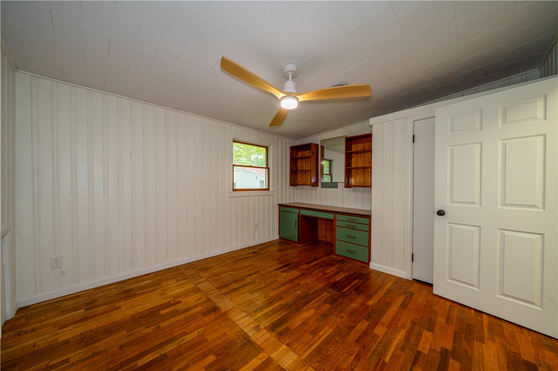 11296 Pansing Road Brookville, OH 45309 - Photo 27 of 53 This bright room features durable hardwood flooring and a built-in desk, perfect for focused work or creative pursuits.