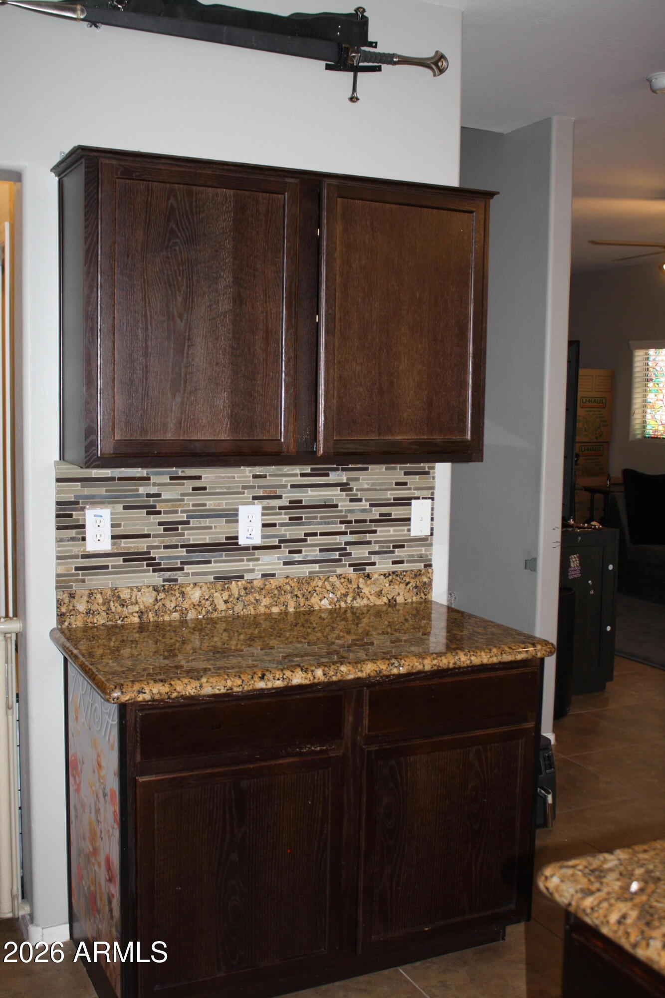 10225 West Camelback Road, Unit 19 Phoenix, AZ 85037 - Photo 13 of 51 a view of kitchen island