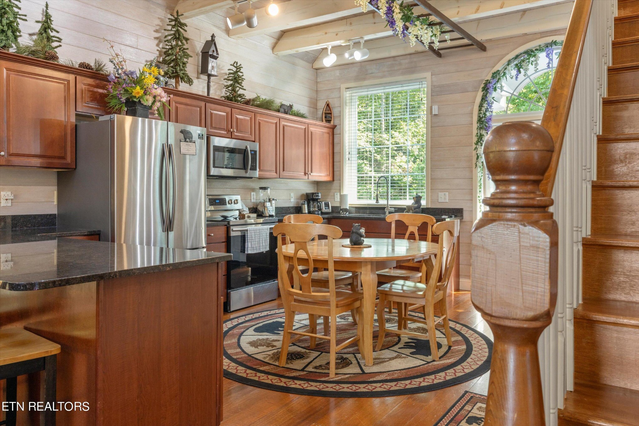 3638 Locust Ridge Road Sevierville, TN 37876 - Photo 13 of 50 a kitchen with sink a refrigerator and chairs