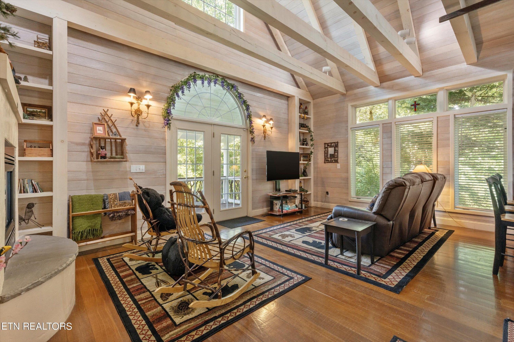 3638 Locust Ridge Road Sevierville, TN 37876 - Photo 21 of 50 a living room with furniture flat screen tv and large windows