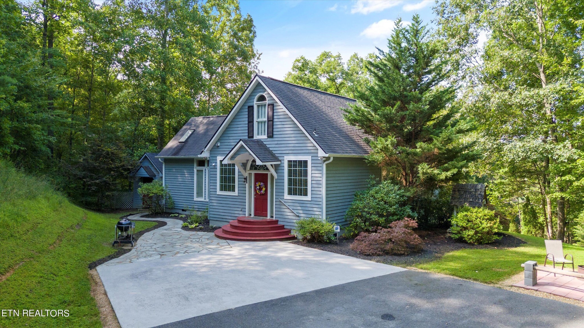 3638 Locust Ridge Road Sevierville, TN 37876 - Photo 7 of 50 a front view of a house with a yard and garage