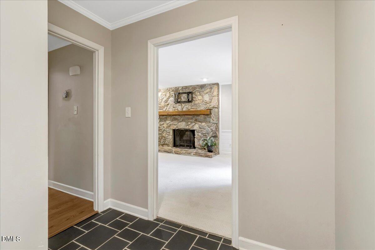 11808 Edgewater Court Raleigh, NC 27614 - Photo 11 of 56 a view of a hallway to rooms and fire place