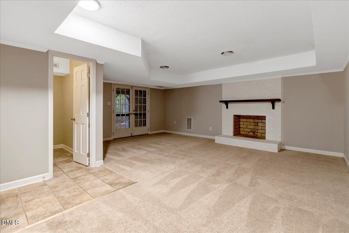 11808 Edgewater Court Raleigh, NC 27614 - Photo 29 of 56 a view of an empty room with a fireplace