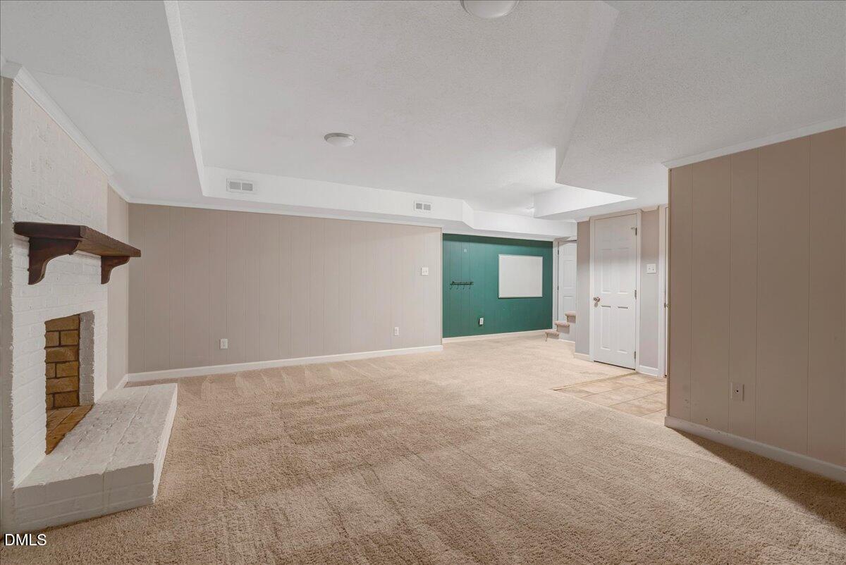 11808 Edgewater Court Raleigh, NC 27614 - Photo 31 of 56 a view of an empty room with a fireplace