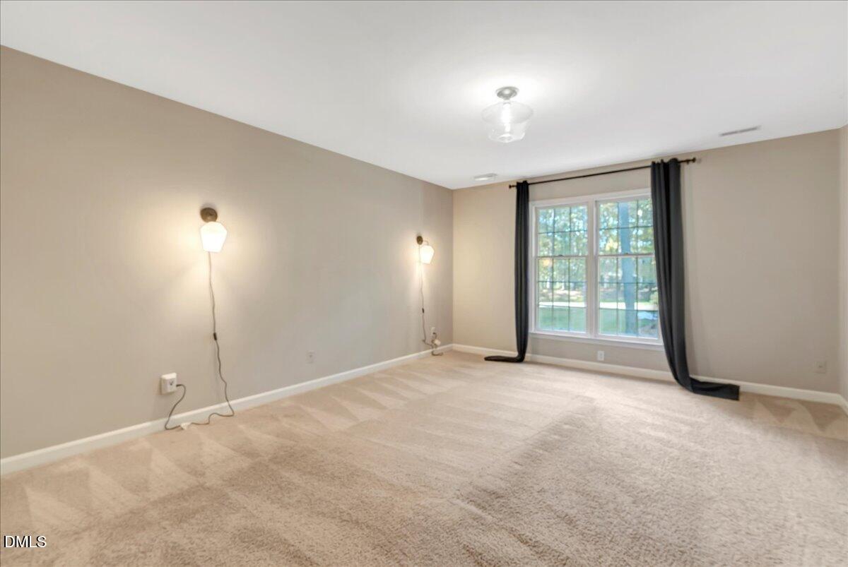 11808 Edgewater Court Raleigh, NC 27614 - Photo 39 of 56 a view of an empty room with a window