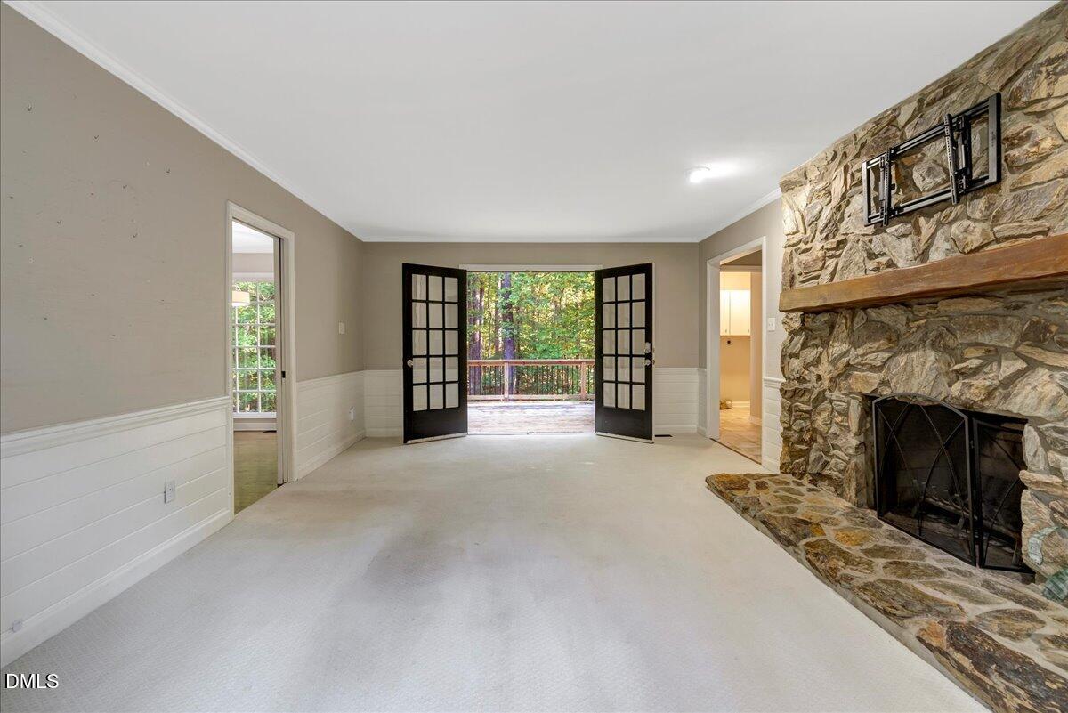 11808 Edgewater Court Raleigh, NC 27614 - Photo 51 of 56 a view of a livingroom with an empty space and a fireplace