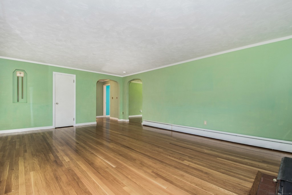 654 North Brookfield Road Oakham, MA 01068 - Photo 12 of 28 a view of room with window and wooden floor