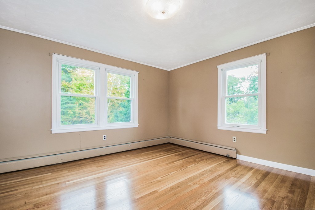 654 North Brookfield Road Oakham, MA 01068 - Photo 14 of 28 a view of an empty room with a window