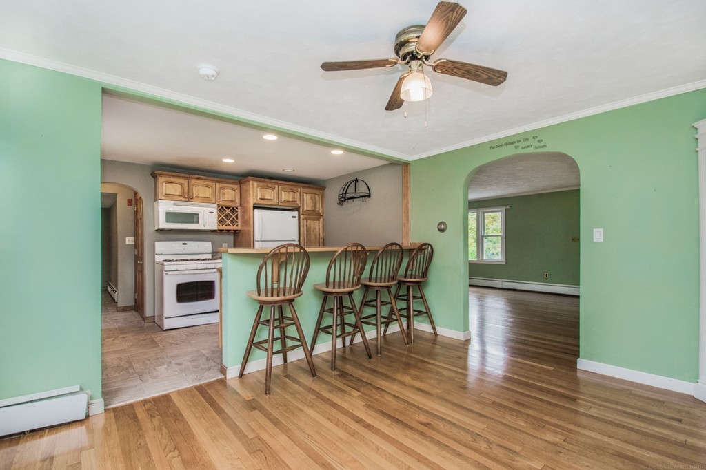 654 North Brookfield Road Oakham, MA 01068 - Photo 6 of 28 a view of a dining room with furniture and wooden floor