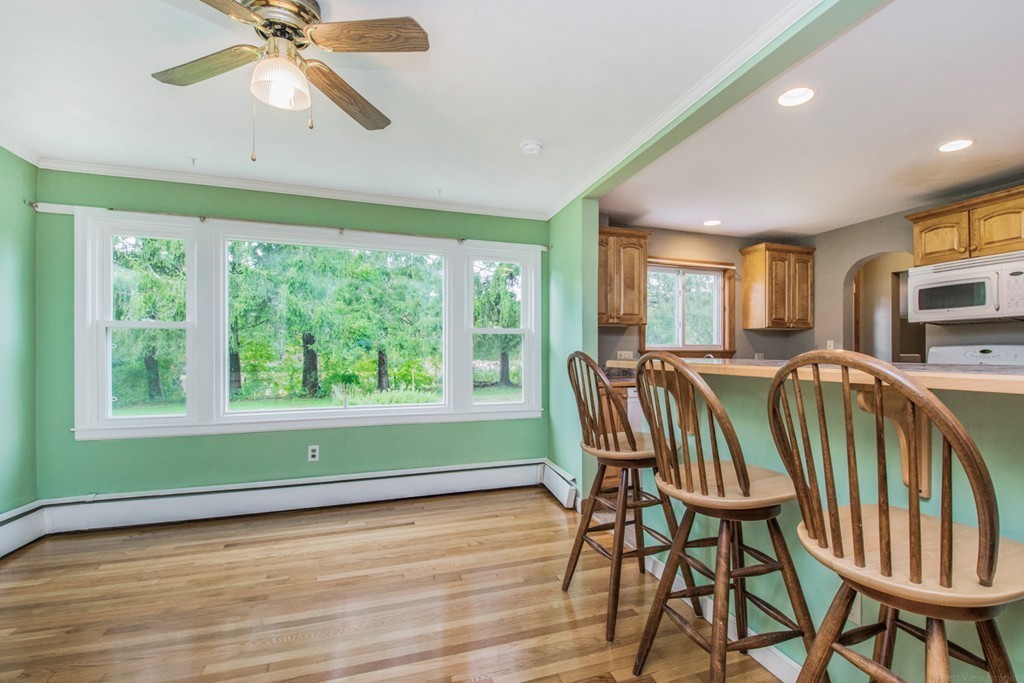654 North Brookfield Road Oakham, MA 01068 - Photo 7 of 28 a view of a dining room with furniture window and wooden floor