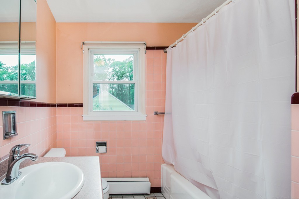 654 North Brookfield Road Oakham, MA 01068 - Photo 9 of 28 a bathroom with a sink toilet and tub