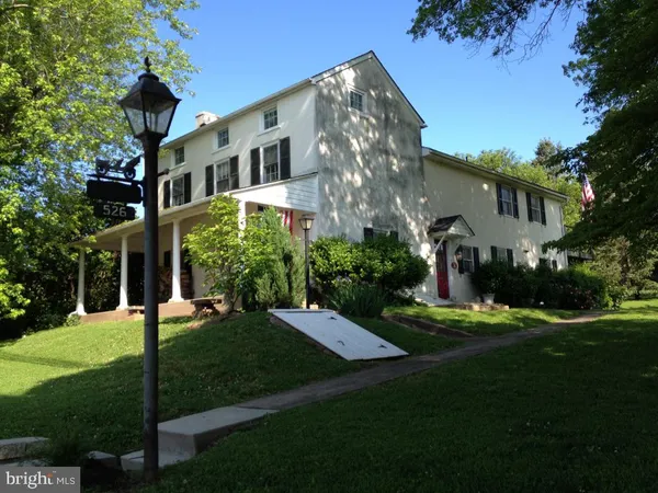 a view of a building with a yard