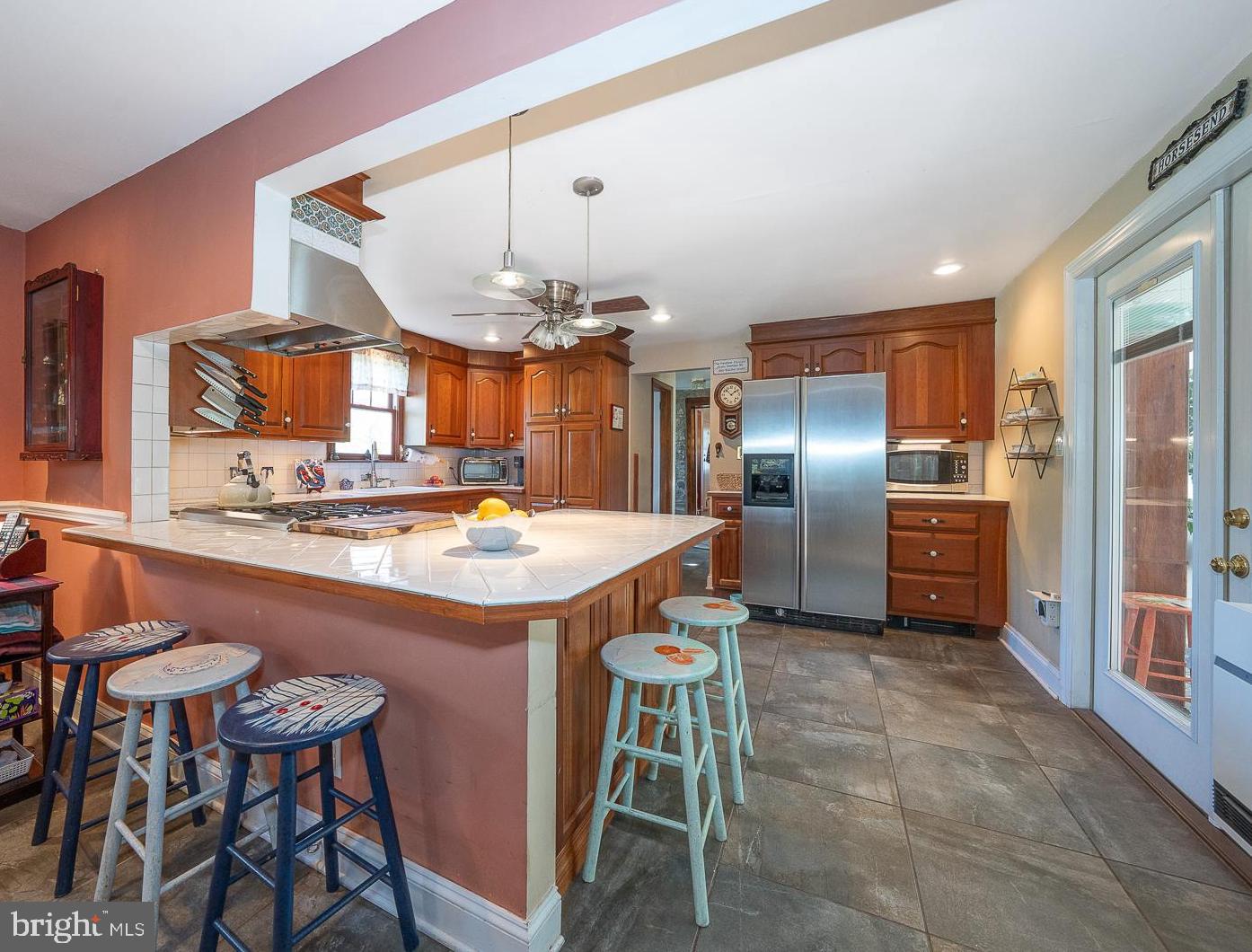 526 Egypt Road Phoenixville, PA 19460 - Photo 11 of 64 a kitchen with cabinets a counter and chairs