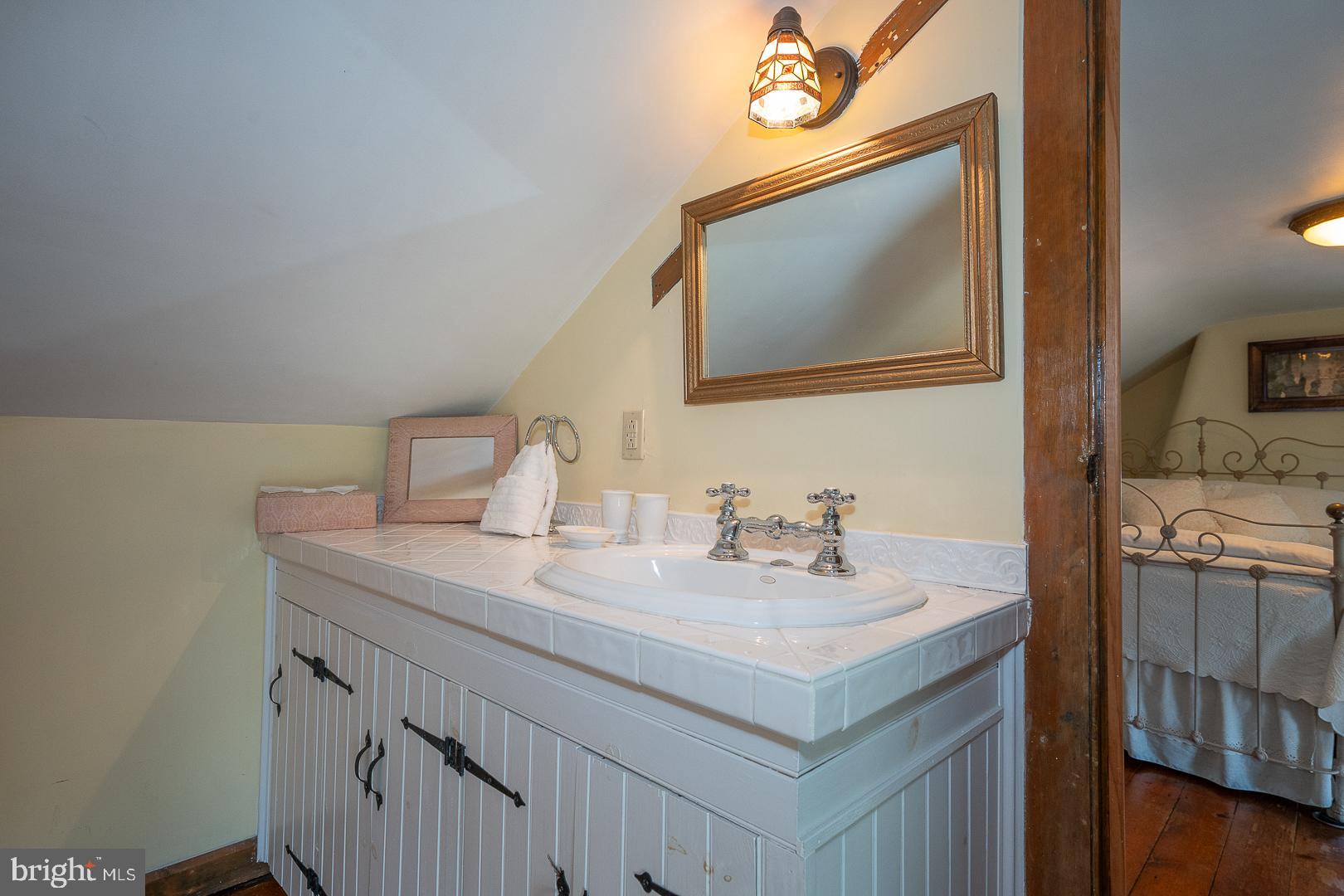 526 Egypt Road Phoenixville, PA 19460 - Photo 25 of 64 a bathroom with a sink vanity and a mirror