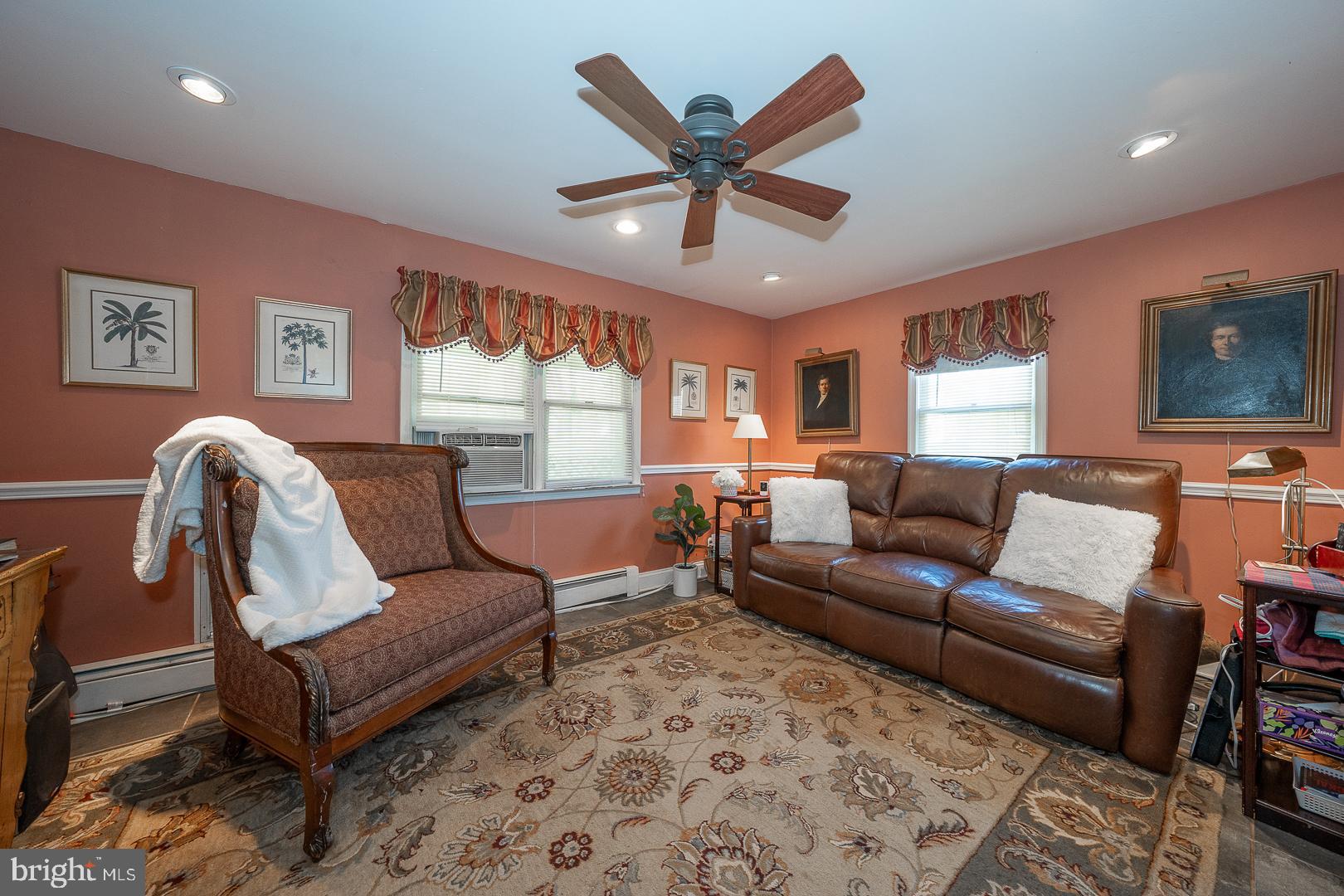 526 Egypt Road Phoenixville, PA 19460 - Photo 10 of 64 a living room with furniture ceiling fan and a window