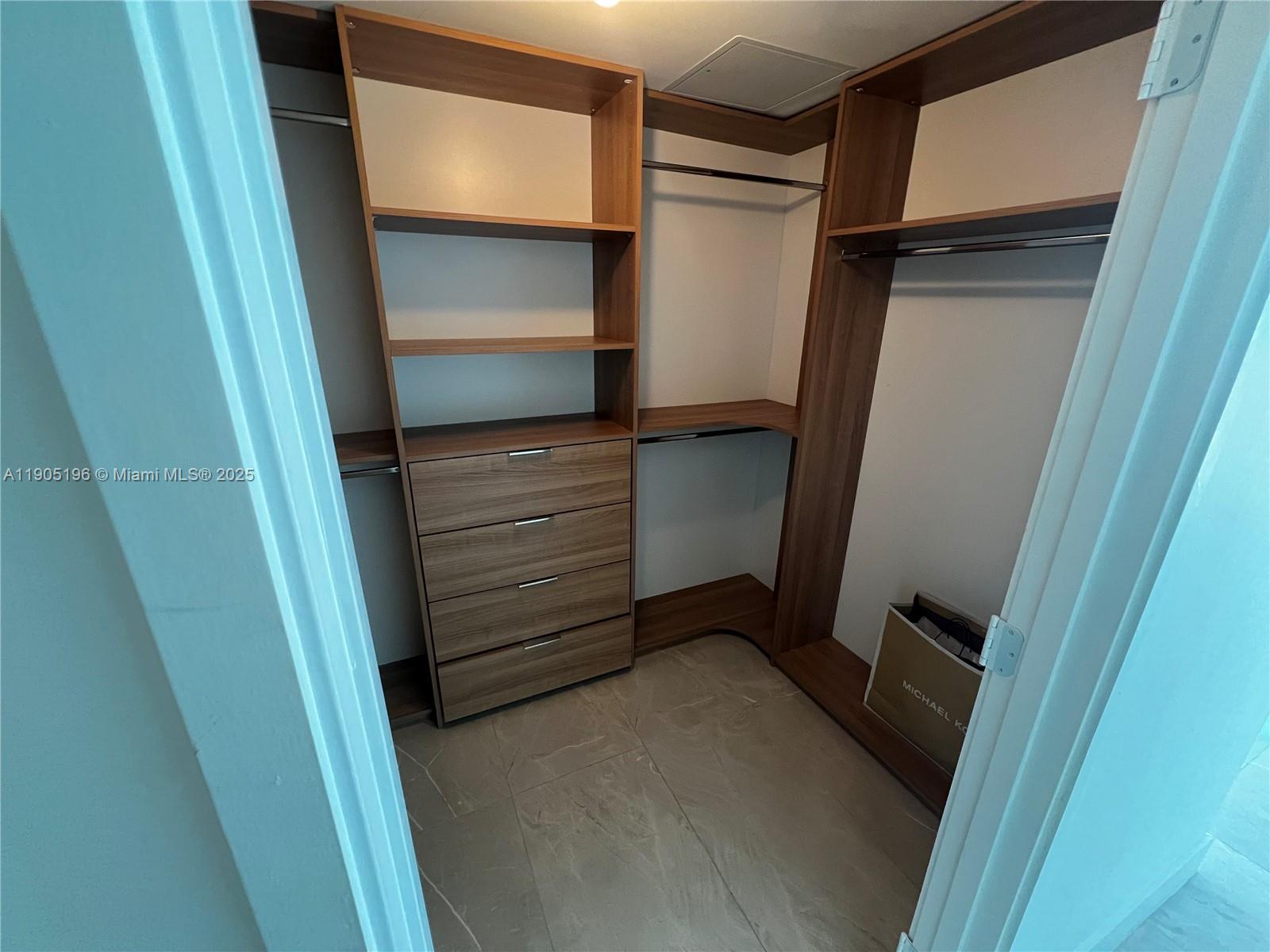 300 Sunny Isles Boulevard, Unit 4901 Sunny Isles Beach, FL 33160 - Photo 13 of 22 a view of walk in closet