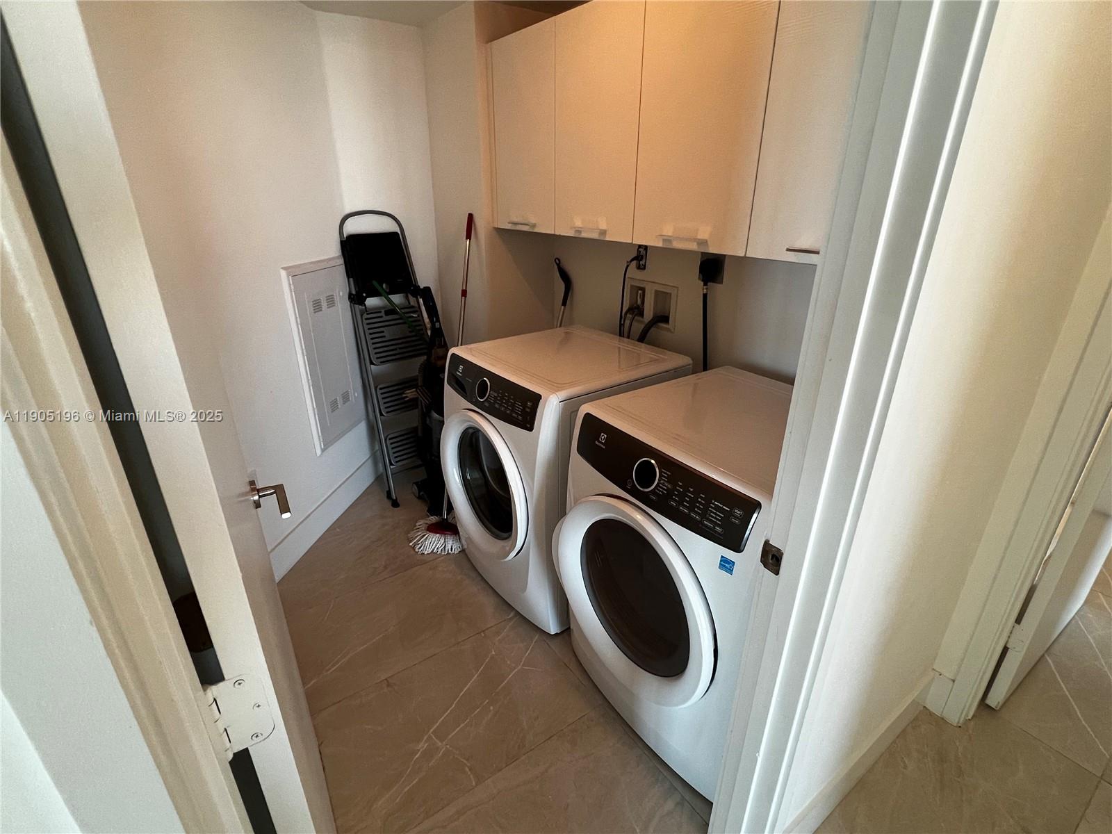 300 Sunny Isles Boulevard, Unit 4901 Sunny Isles Beach, FL 33160 - Photo 10 of 22 a utility room with dryer and washer