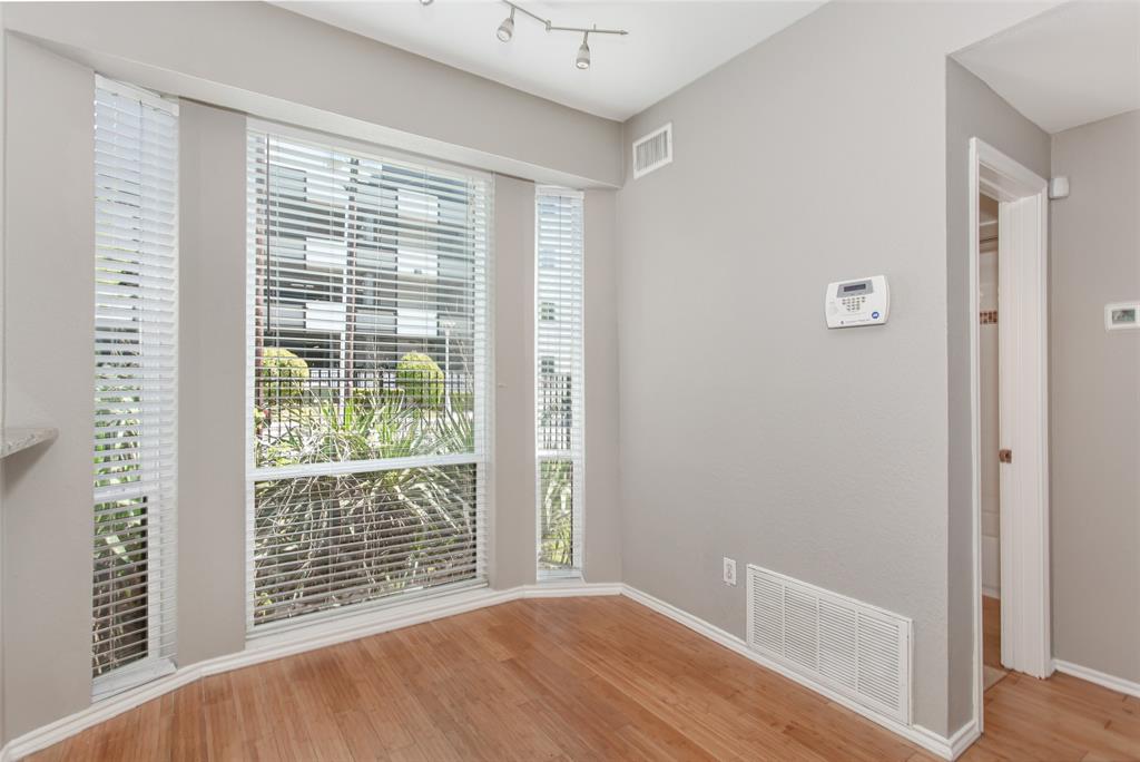 2002 North Fitzhugh Avenue, Unit 2 Dallas, TX 75204 - Photo 11 of 29 a view of an empty room with wooden floor and a window