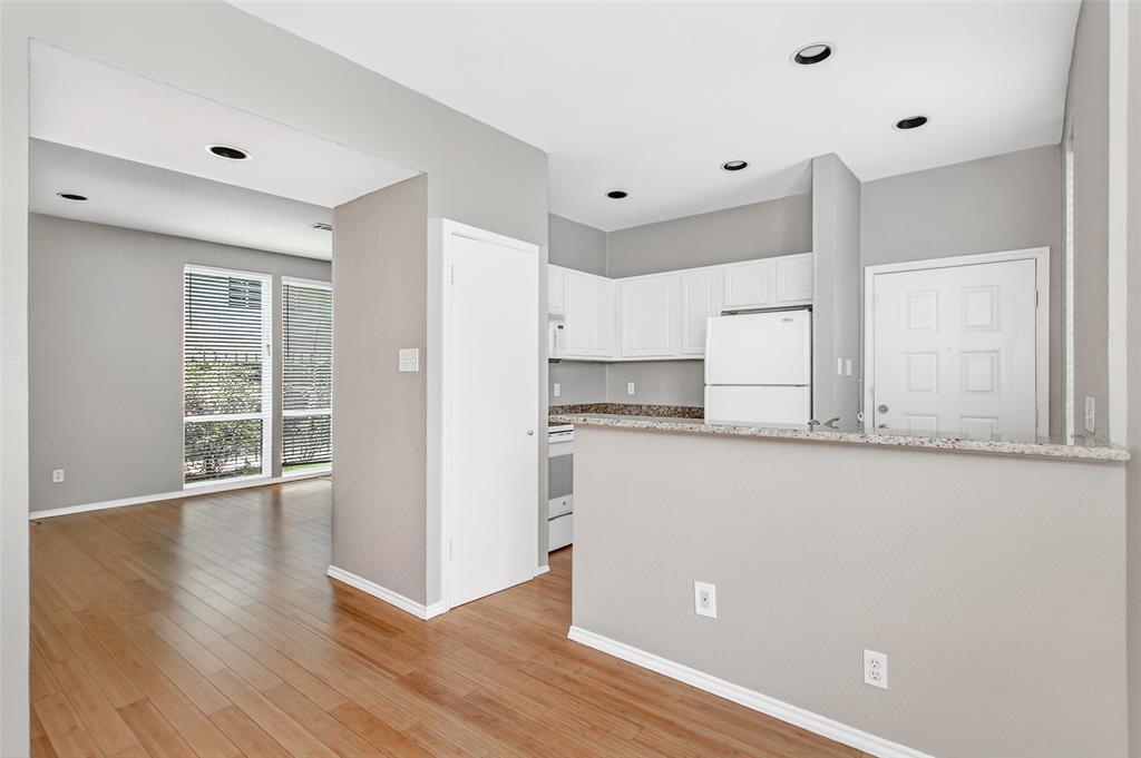2002 North Fitzhugh Avenue, Unit 2 Dallas, TX 75204 - Photo 12 of 29 a view of a kitchen with wooden floor and electronic appliances