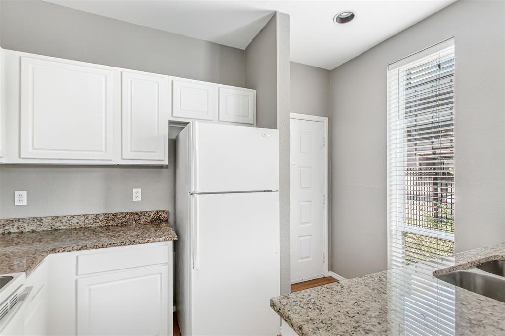 2002 North Fitzhugh Avenue, Unit 2 Dallas, TX 75204 - Photo 6 of 29 a white refrigerator freezer sitting inside of a kitchen