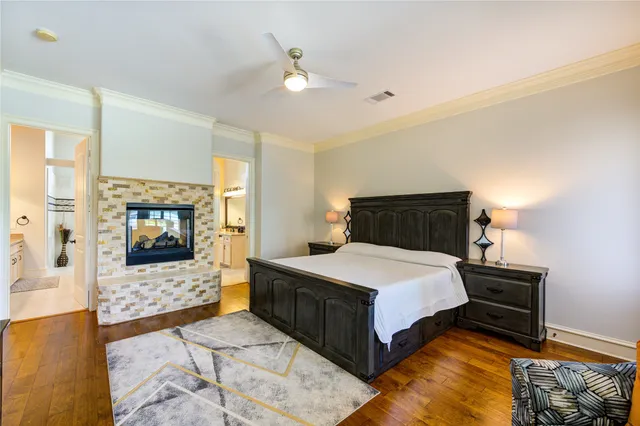 a bedroom with a bed and a television