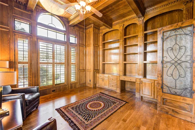 a living room with a bed furniture and a window