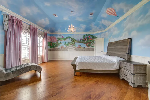 a bedroom with furniture and a window