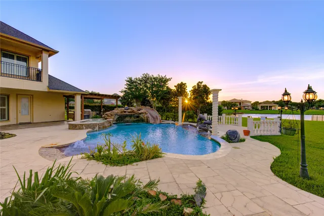 a living room with patio furniture and a large window