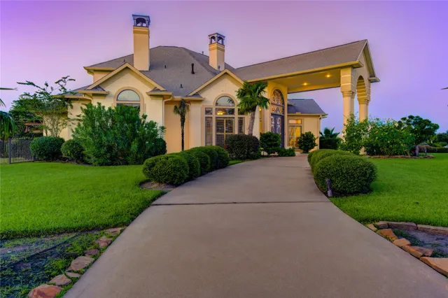 an aerial view of a house with a lake view