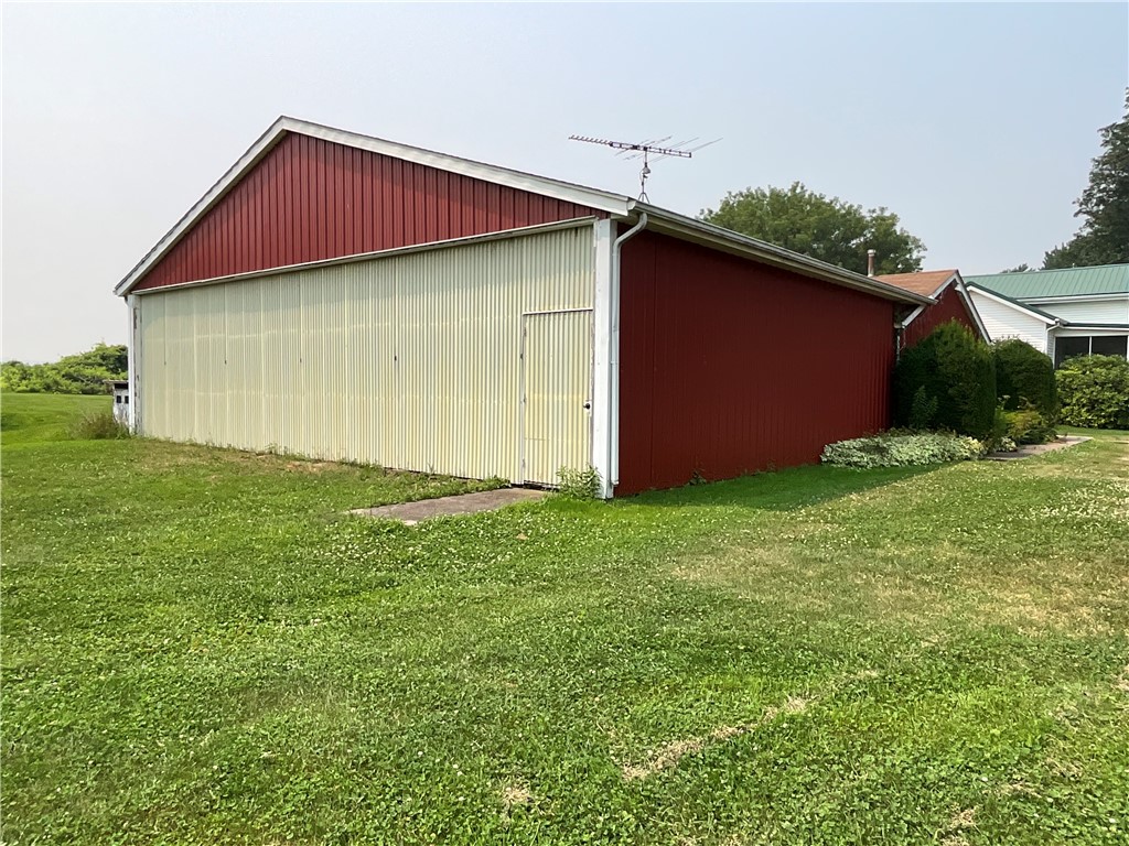 13576 Ridge Road West Gaines, NY 14411 - Photo 4 of 23 The east side of the building is the hangar space