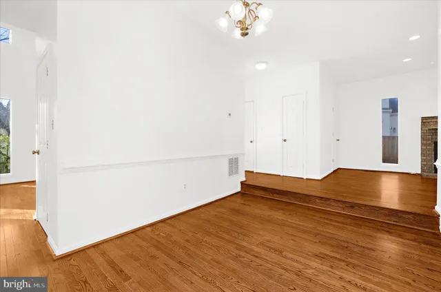 a view of kitchen with kitchen island and stainless steel appliances