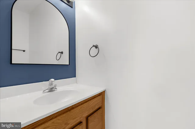 a kitchen with stainless steel appliances wooden cabinets stove and a granite counter top