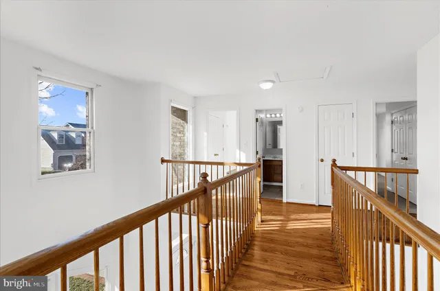 a bathroom with a tub a sink and a large mirror
