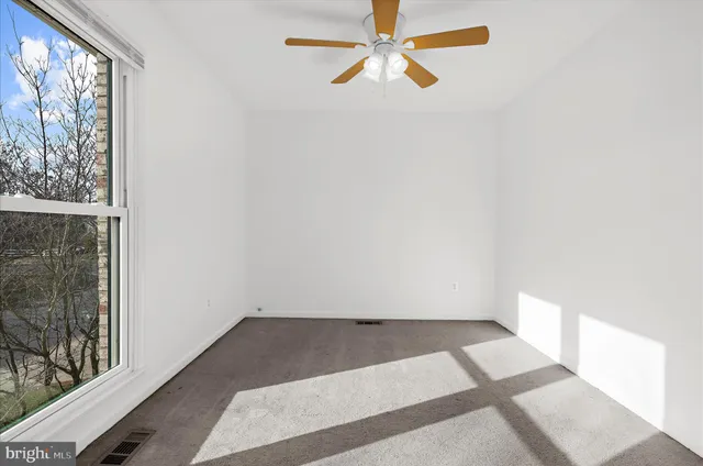 a view of backyard with deck and wooden floor