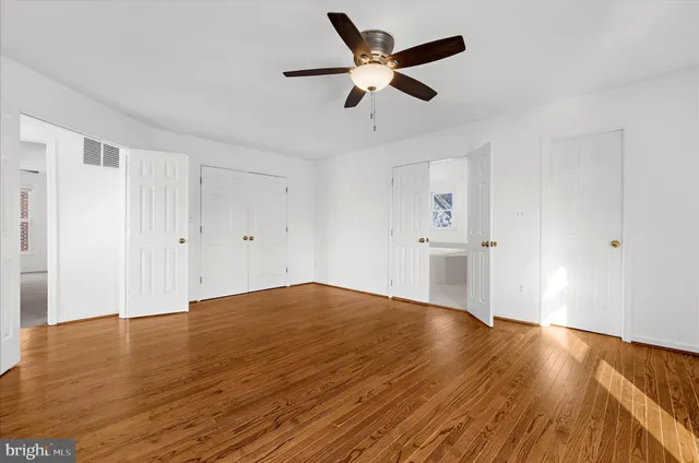an aerial view of a house with swimming pool and lake view