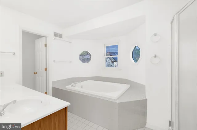 an aerial view of residential house with outdoor space and parking