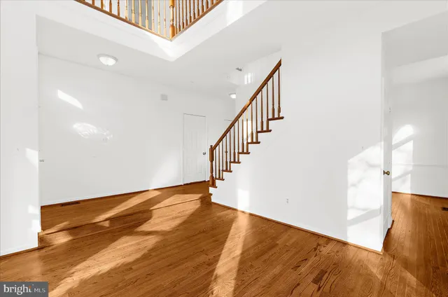 a view of an empty room with stairs