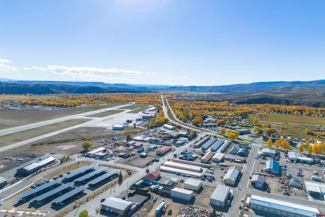 an aerial view of residential building and ocean view